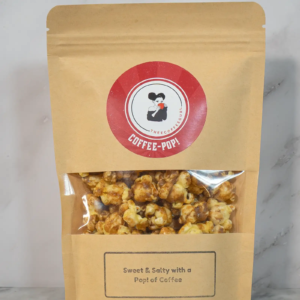 Bag of coffee-flavored popcorn with sweet and salty taste, labeled "Coffee-Pop!" from Thee Coffee Co.
